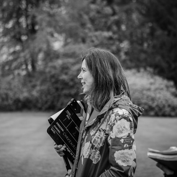 Video producer Ellie Edwards holding a clipboard